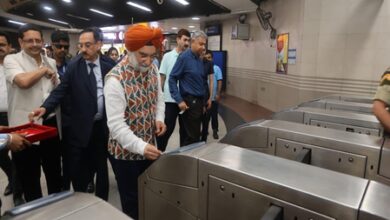 Delhi L-G Sandhu travels in Metro, poses for selfies with youth