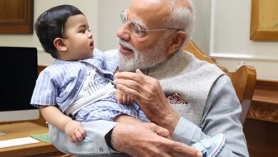 PM Modi cradles little Omy, melts hearts across social media​