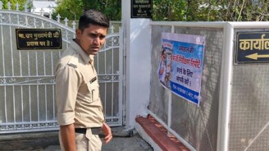 NSUI members paste posters outside Dy CM Rajendra Shukla’s office in Bhopal