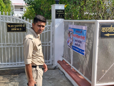 NSUI members paste posters outside Dy CM Rajendra Shukla’s office in Bhopal