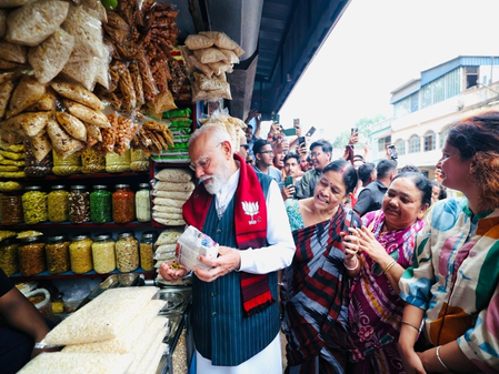 On Bengal campaign trail, PM Modi stops for popular street snack ‘jhalmuri’ in Jhargram
