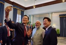 Samsung chief clicks selfie with PM Modi, S. Korean President at Noida facility
