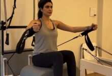 Mommy-to-be Karishma Tanna flaunts her baby bump as she works out in the gym