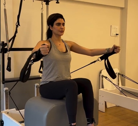 Mommy-to-be Karishma Tanna flaunts her baby bump as she works out in the gym