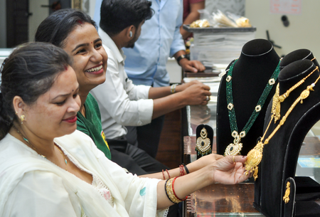 Gold slips, silver gains amid rising West Asia tensions
