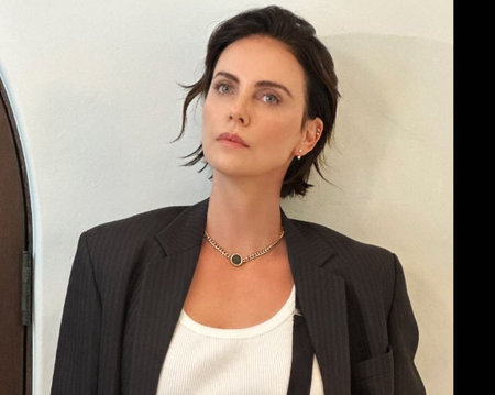 Charlize Theron says her kids will have to work for a living