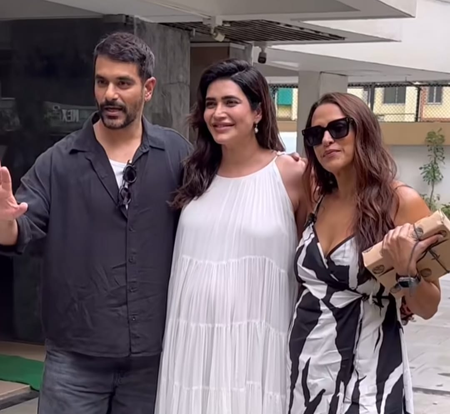Karishma Tanna asks paps to stop focusing on her baby bump as she poses with Neha Dhupia, Angad Bedi Karishma Tanna asks paps to stop focusing on her baby bump as she poses with Neha Dhupia, Angad Bedi