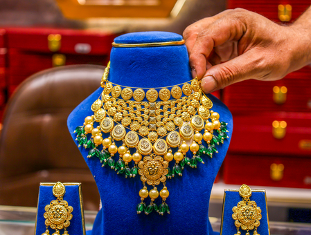Gold, silver trade higher as easing crude and bond yields support precious metals