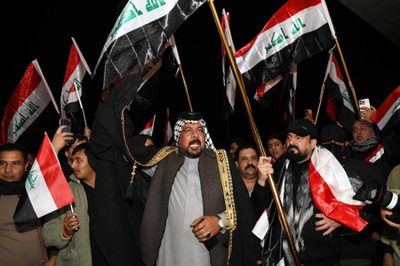 Iraqi militia umbrella group says ‘postpones’ retaliation against US forces Iraqi militia umbrella group says ‘postpones’ retaliation against US forces