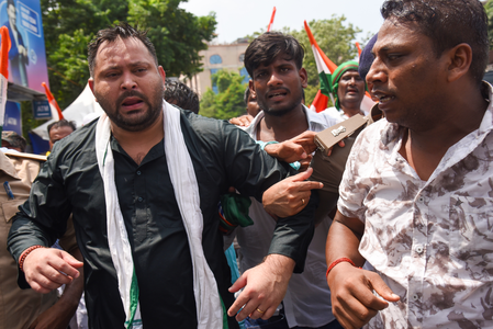 Tejashwi Yadav detained during protest march in Patna; water cannon used to disperse RJD supporters Tejashwi Yadav detained during protest march in Patna; water cannon used to disperse RJD supporters