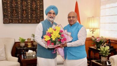 Delhi Assembly Speaker presents magazine to L-G