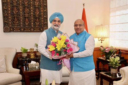 Delhi Assembly Speaker presents magazine to L-G