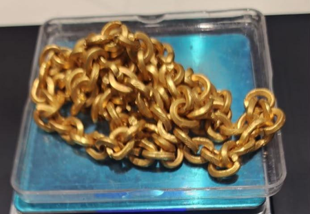 Woman passenger held with Rs 83 lakh gold chain concealed in sweater at Ahmedabad airport Woman passenger held with Rs 83 lakh gold chain concealed in sweater at Ahmedabad airport