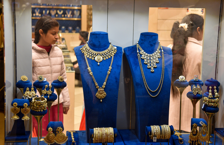 Gold, silver trade flat as dollar, US yields rise ahead of Fed decision
