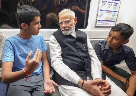 PM Modi’s ride in Delhi Metro happily surprises children, co-passengers PM Modi’s ride in Delhi Metro happily surprises children, co-passengers